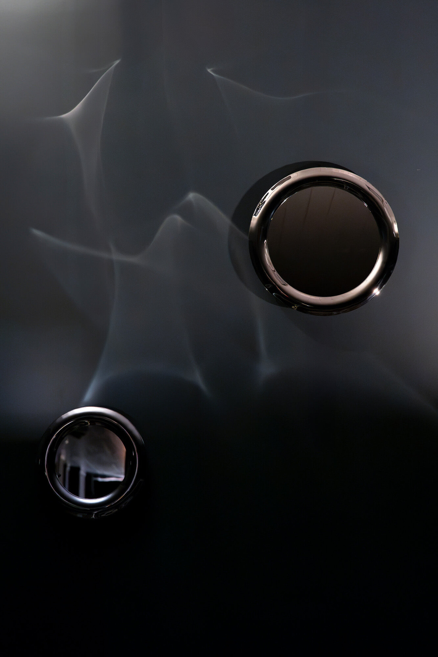 Zieta's lampin and rondel with reflections on the wall