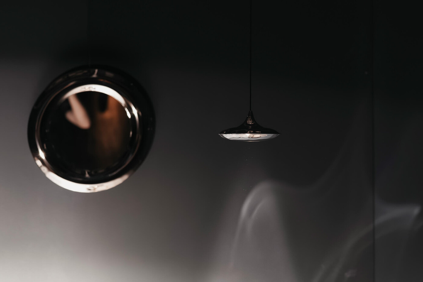 Zieta's lampin and rondel with reflections on the wall