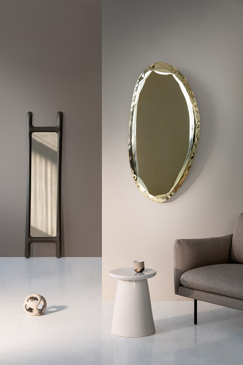 MIRROR MADE OF STAINLESS STEEL HANGING ON THE WALL